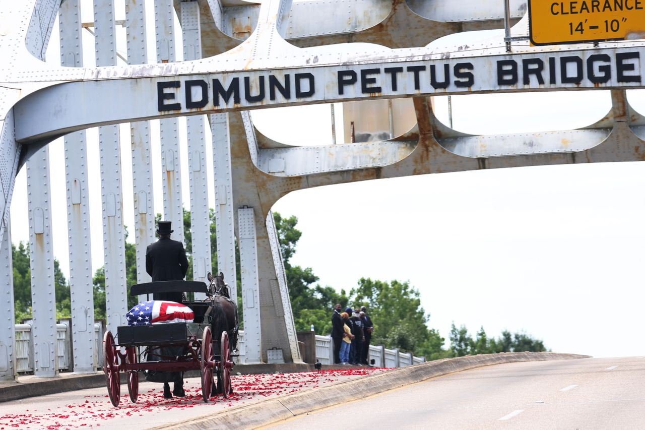 John Lewis&amp;#039; body is pulled across the Edmund Pettus Bridge