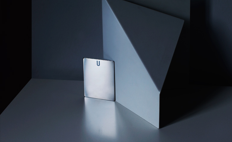 strikingly minimal slice of polished steel, complemented by the unusual weight of the space-age metal object