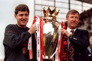 Manchester United manager Alex Ferguson and assistant manager Brian Kidd with the Premier League trophy, 1996