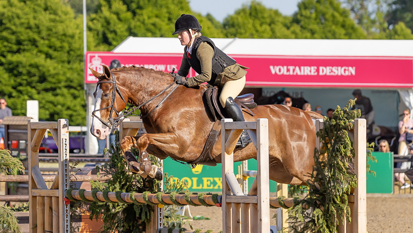 Ruby Ward and Noble Banksy clear a jump on their way to winning the intermediate working hunter and being crowned working hunter pony champions