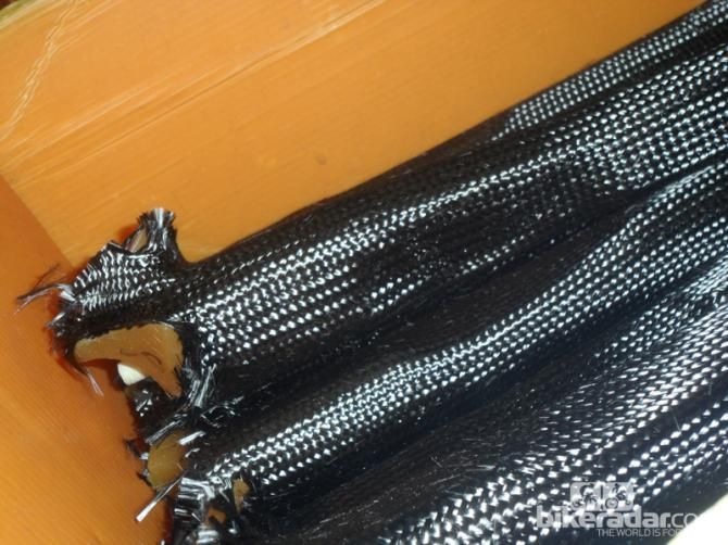 Numerous layers of wovens socks are drawn over the wax forms