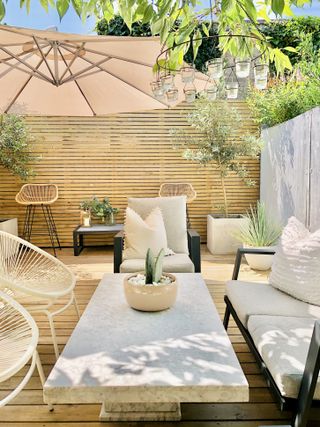 a stylish modern deck in a neutral garden