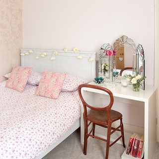 bedroom with wallpaper and desk