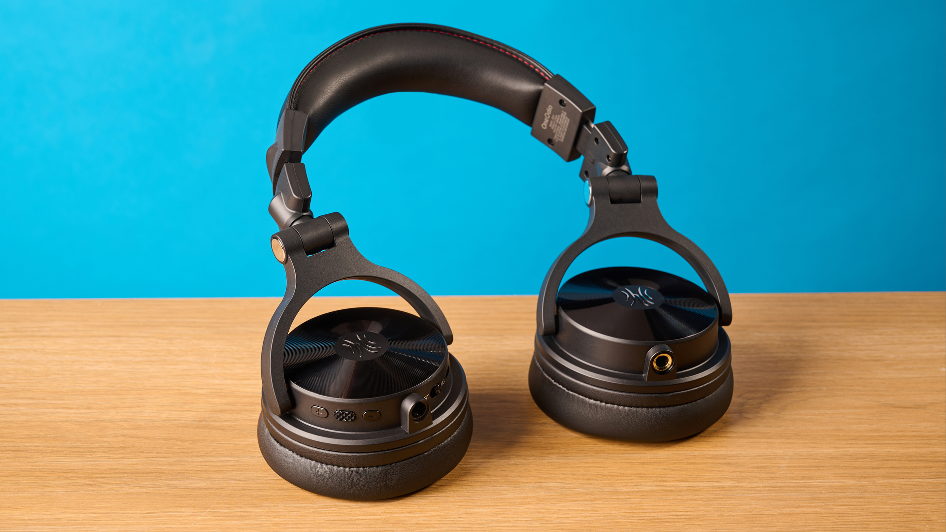 OneOdio Studio Max 2 in black photographed in front of a blue background