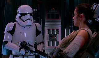 Stormtrooper and Daisy Ridley as Rey in Star Wars: The Force Awakens`