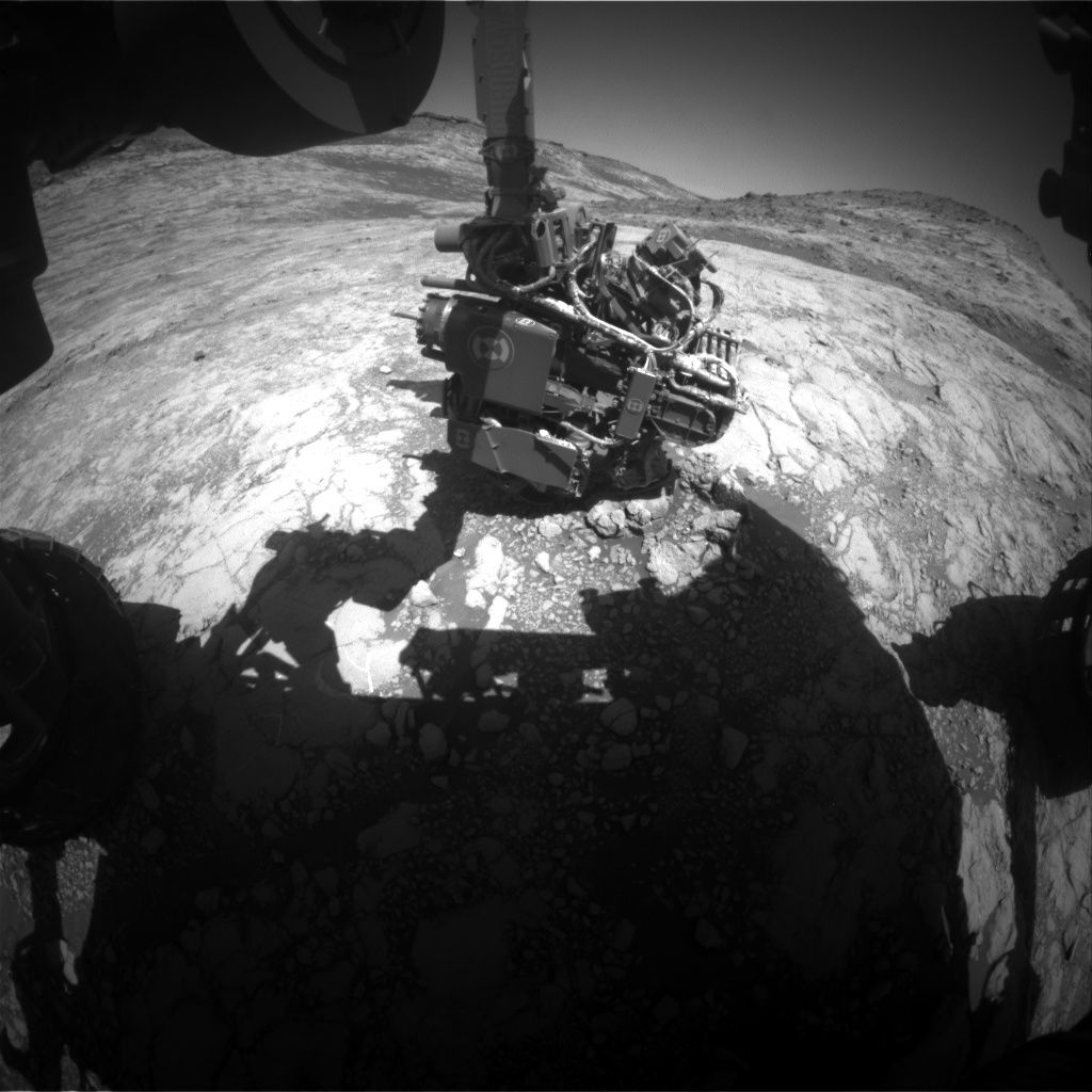  This image by one of the Curiosity Mars rover’s hazard cameras shows the robot’s arm extended out to perform an analysis of the bedrock. Curiosity has to know the exact angle of every joint to move safely. 