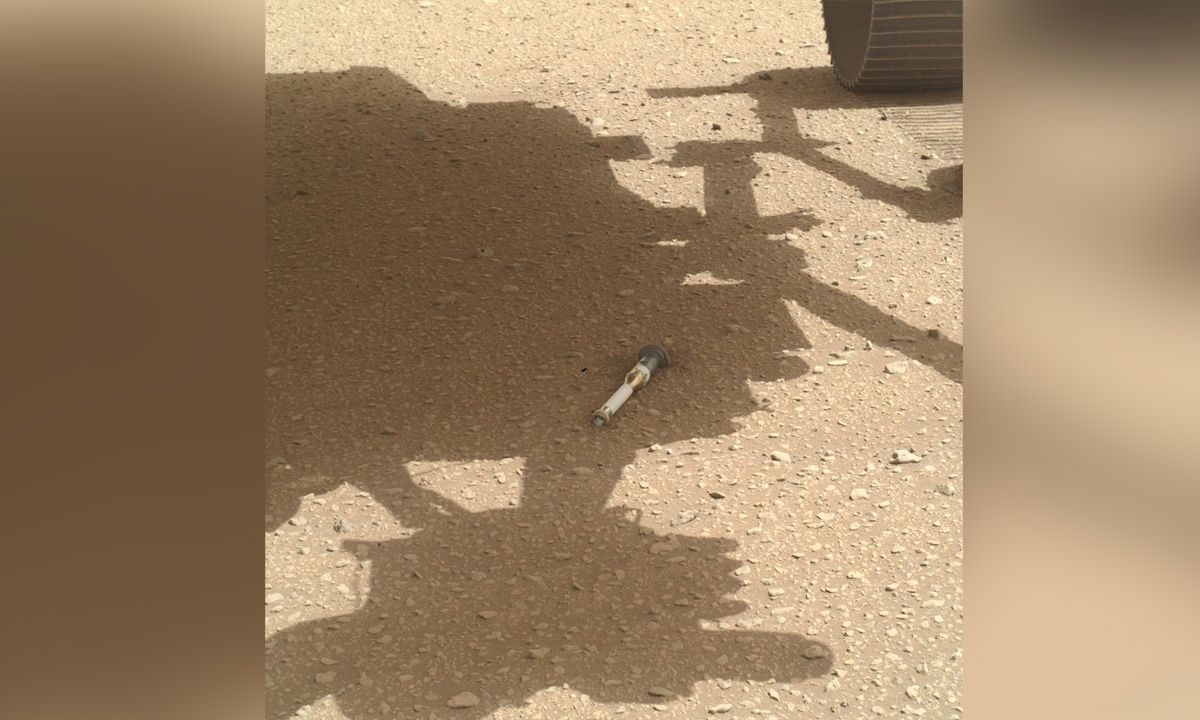 Photo of Mars rover Perseverance&#039;s second sample tube on the Martian surface in rover&#039;s shadow