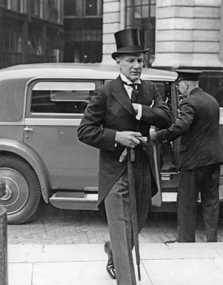 1930s black and white photograph of man in a top hat