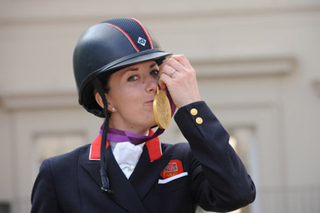 A golden kiss: Charlotte with her treasured medal
