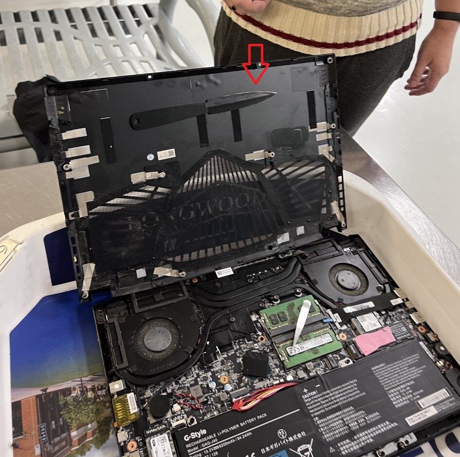 A knife taped into the case of a gaming laptop.