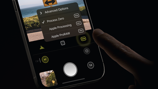Finger reaching out to select one of the RAW capture options in the Halide camera app for iPhone