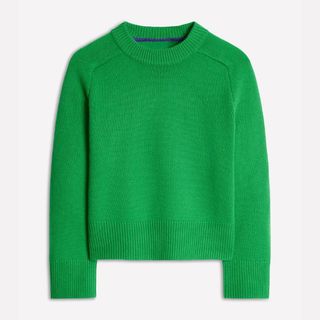 A cutout of a bright green crew neck cashmere jumper from Boden on a pale background