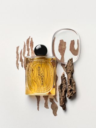 Diptyque Bois Corsé perfume bottle and bark