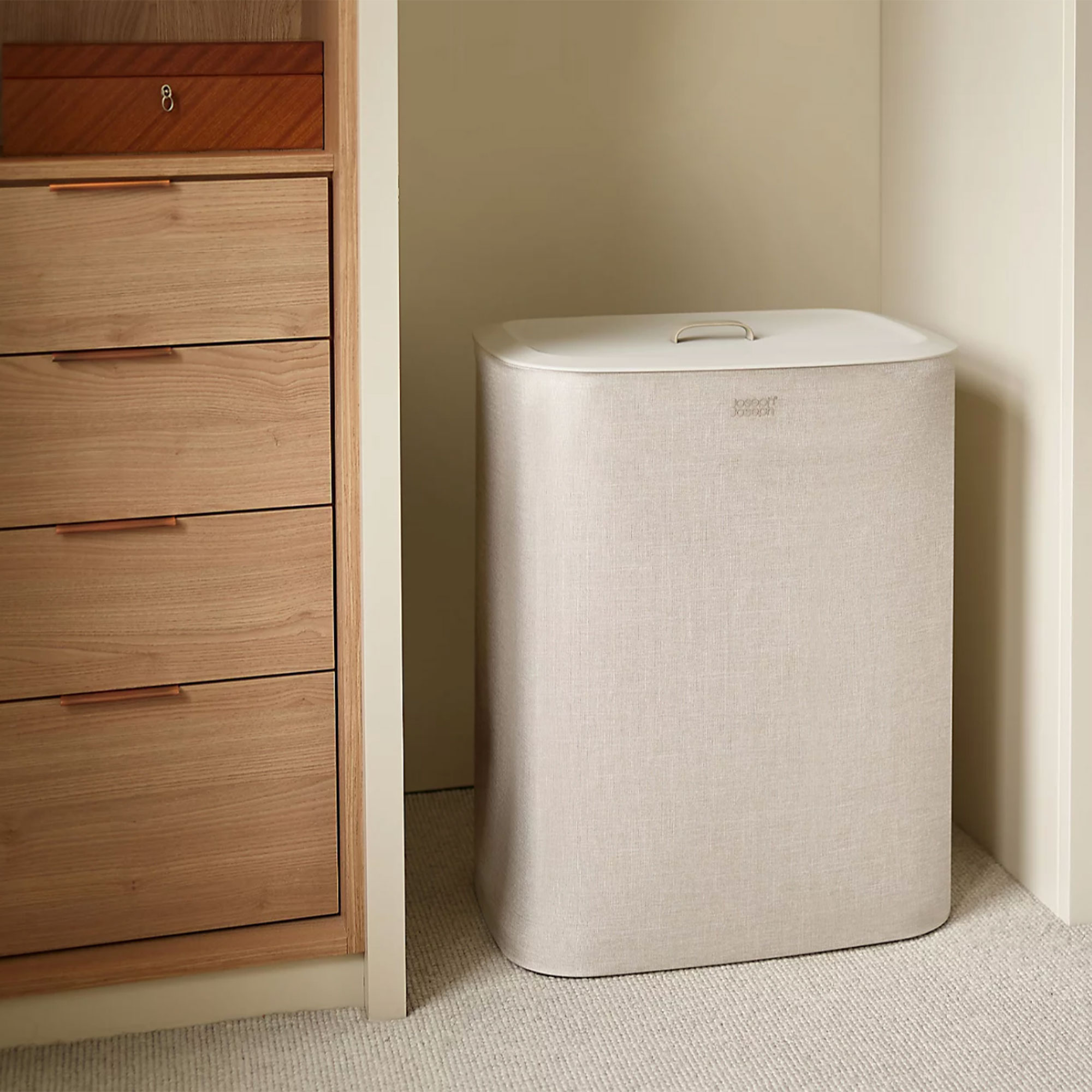 Ecru Joseph Joseph Tota laundry basket in corner of room