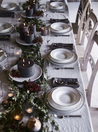 Christmas tablescape and table centerpiece ideas, dark candles and foliage by Neptune