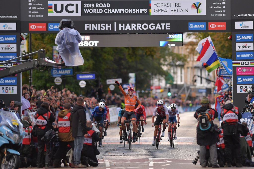 Nils Eekhoff celebrates after the finish of the U23 road race