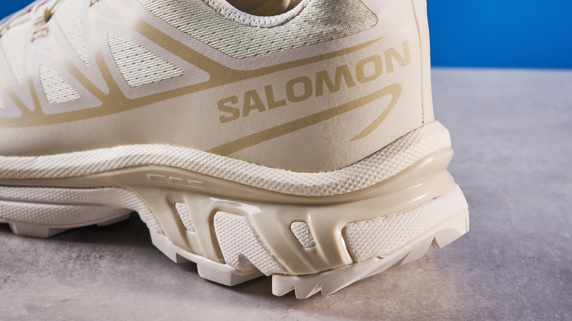Salomon XT-6 in Vanilla Ice photographed in front of a blue background