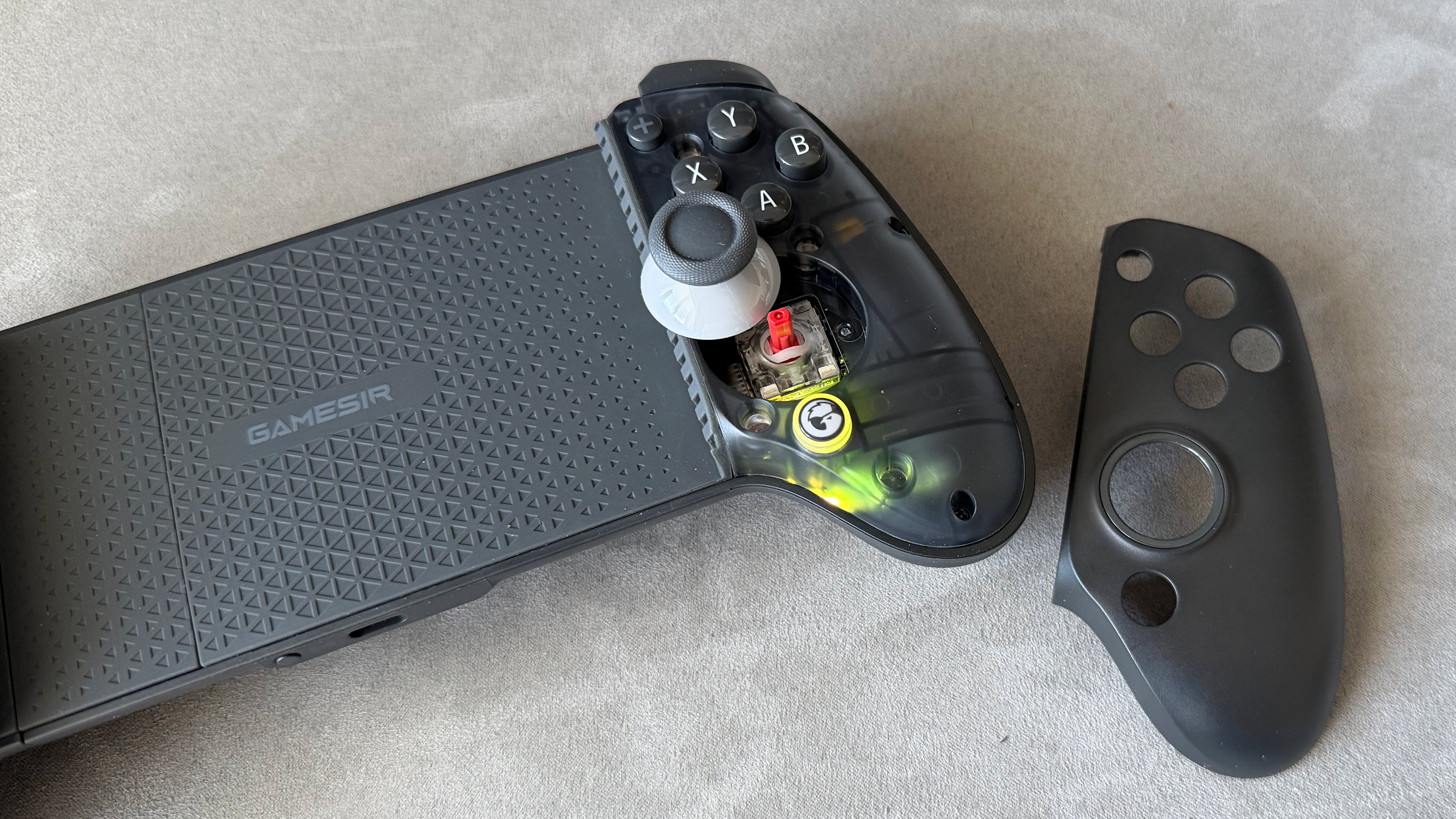 A black model of the GameSir G8 Plus Bluetooth mobile controller on a clean grey surface.