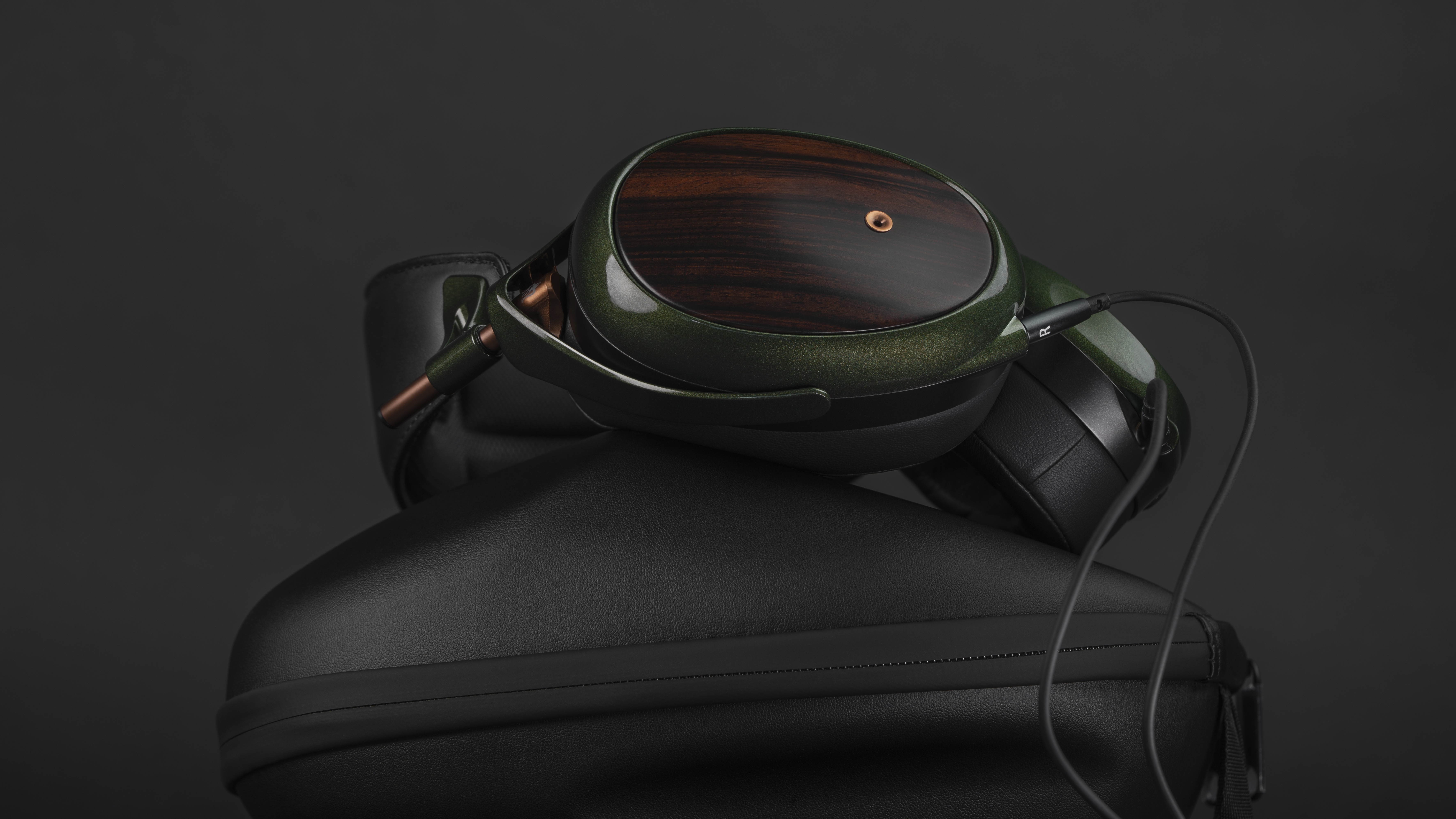 Meze Audio Strada over-ear headphones on top of their case