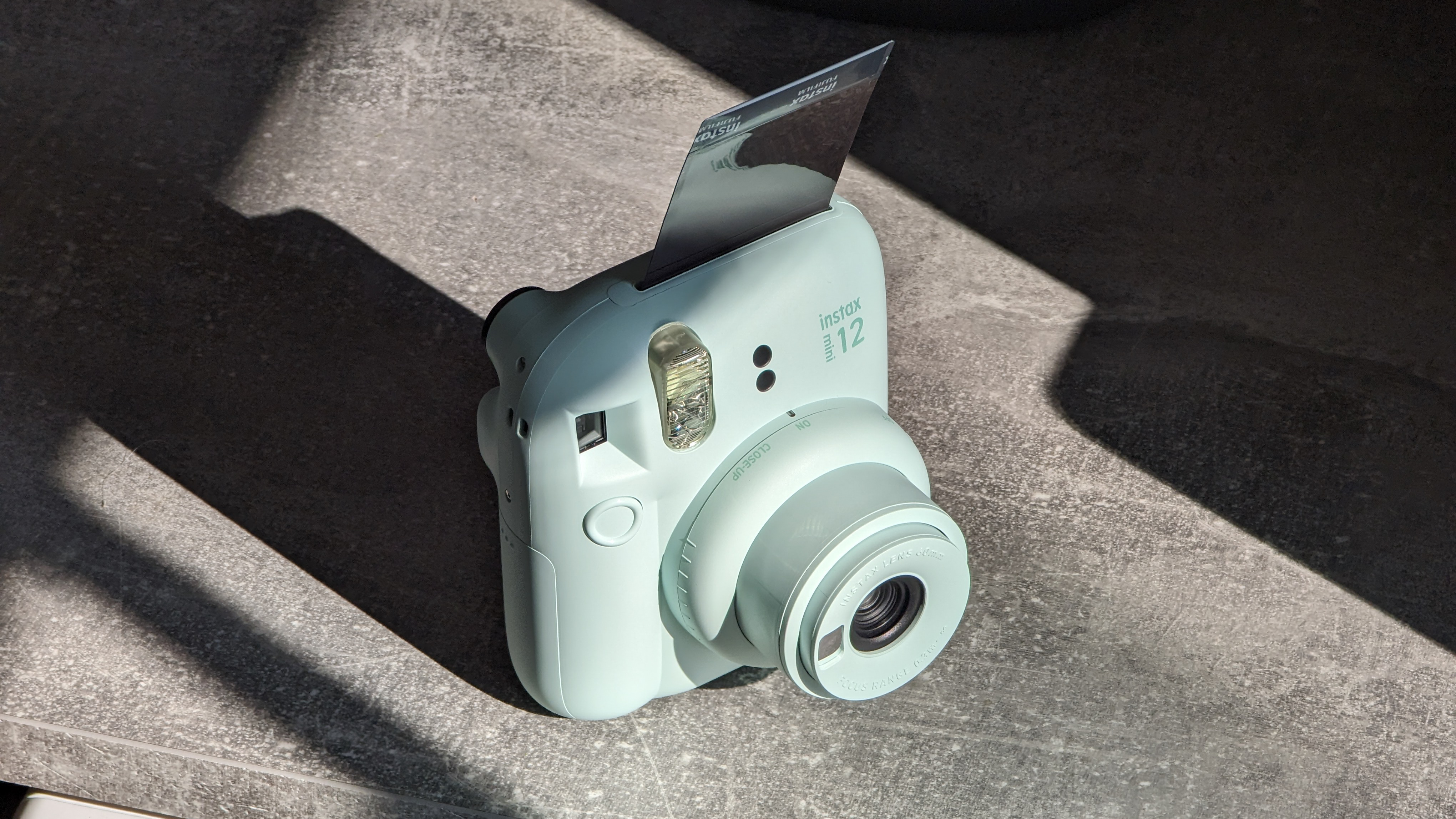 Fujifilm Instax Mini 12 instant camera in green