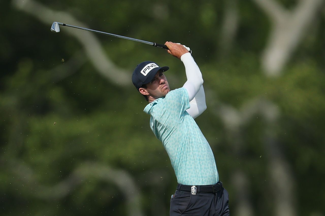 Alex Smalley hits an approach shot on the 10th hole during the third round of the PGA Championship at Aronimink Golf Club