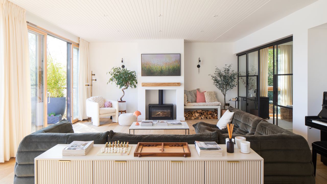 Traditional stove fireplace in modern living room underneath TV