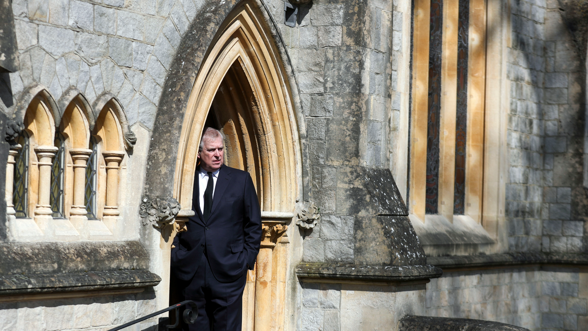 Prince Andrew standing in the archway of the chapel at Royal Lodge