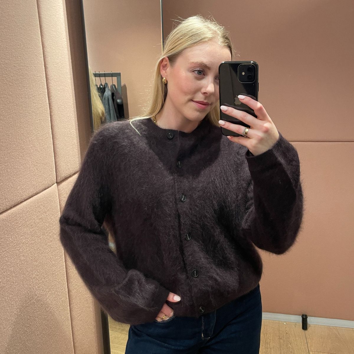 Woman wears brown brushed cashmere cardigan and blue jeans 