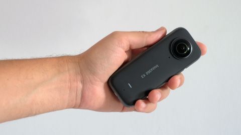 Insta360 X3 in the hand white background