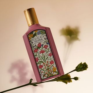 Gucci Flora Gorgeous Gardenia Eau de Parfum floral perfume shot on a flower stem