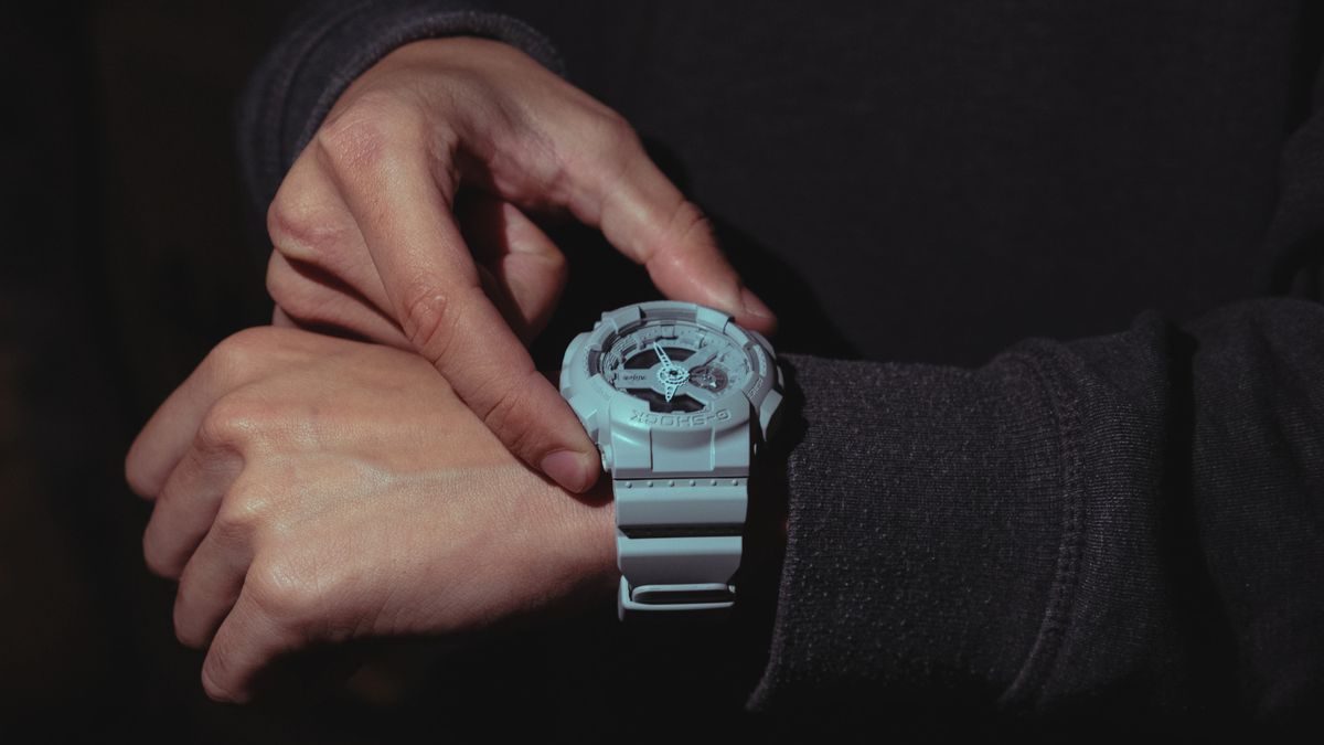 Casio G-Shock watch on man&#039;s wrist at night