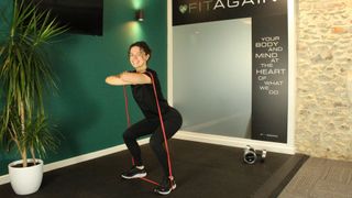 Personal trainer Alanah Bray performs front squat