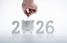2026 new year and piggy bank on white background. The concept of saving money in 2026