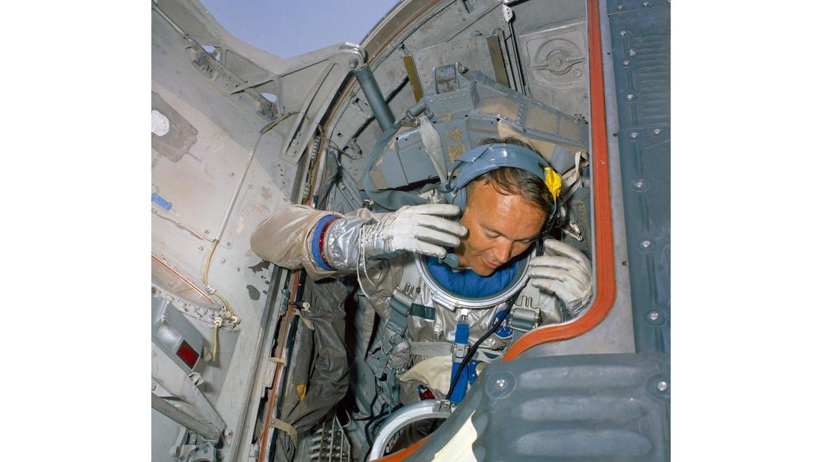 Astronaut Michael Collins conducts a water egress training activity for NASA's Gemini 10 spaceflight.