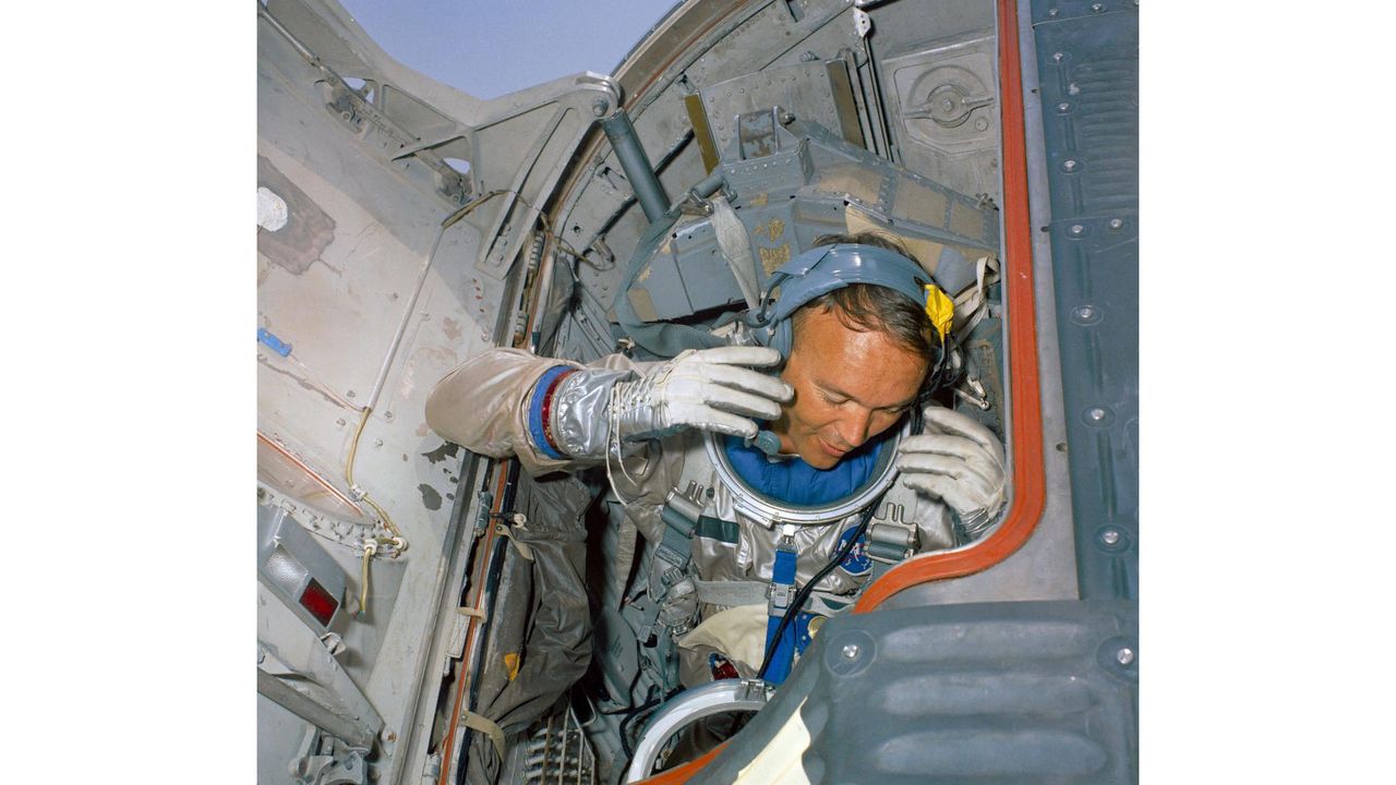 Astronaut Michael Collins conducts a water egress training activity for NASA's Gemini 10 spaceflight.