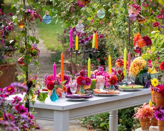 A table decorated with cut dahlia flowers