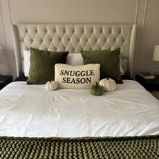 bed with pumpkin cushions on it