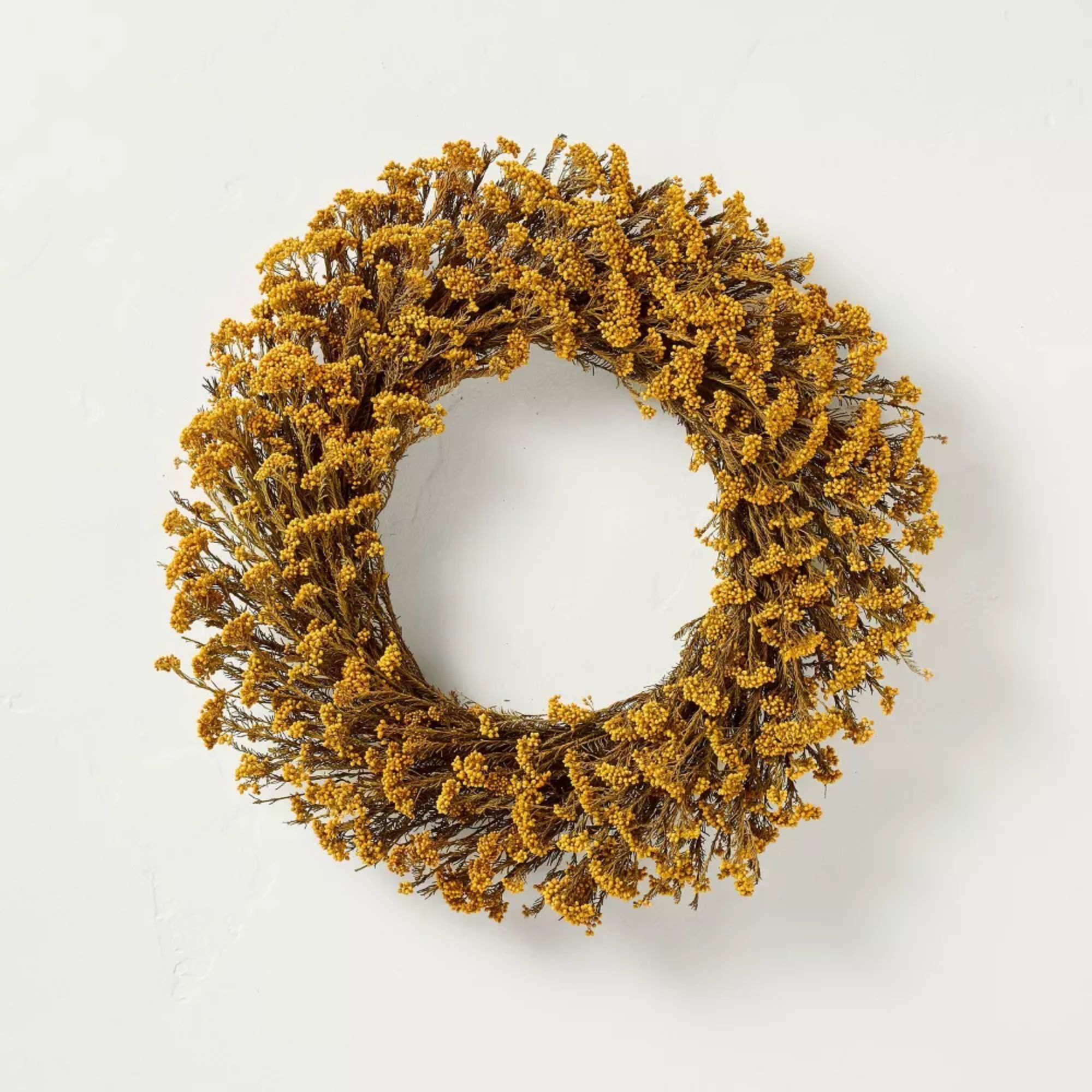 Faux flower wreath made from faux golden yarrow flowers