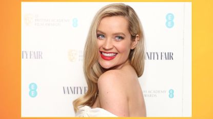 image of Laura Whitmore attending the Vanity Fair EE Rising Star Party on a yellow-orange backfround