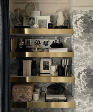 gold shelves in bedroom