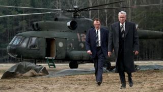 (L-R) Jared Harris as Valery Legasov and Stellan Skarsgård as Boris Shcherbina disembark from a helicopter in Chernobyl