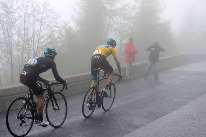 Chris Froome and Richie Porte disappear into the mist.
