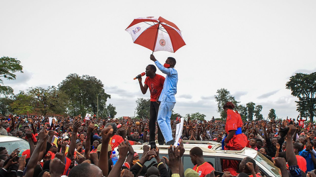 Ugandan musician turned politician Robert Kyagulanyi is introduced to supporters during a presidential rally