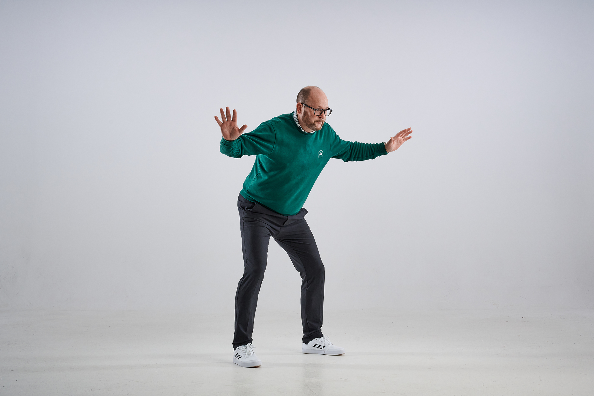 Top 50 Coach Russell Covey in an athletic 'goalkeeper' style pose to demonstrate correct weight distribution and position