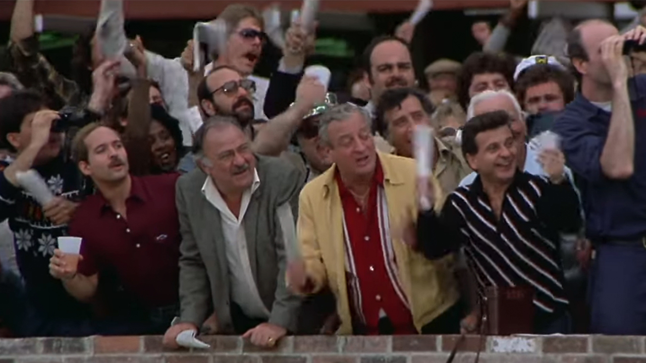 Rodney Dangerfield and Joe Pesci cheering on a horse race in Easy Money