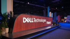 A large wooden sign bearing the Dell Technologies World logo shown on the show floor at Dell Technologies World 2025.