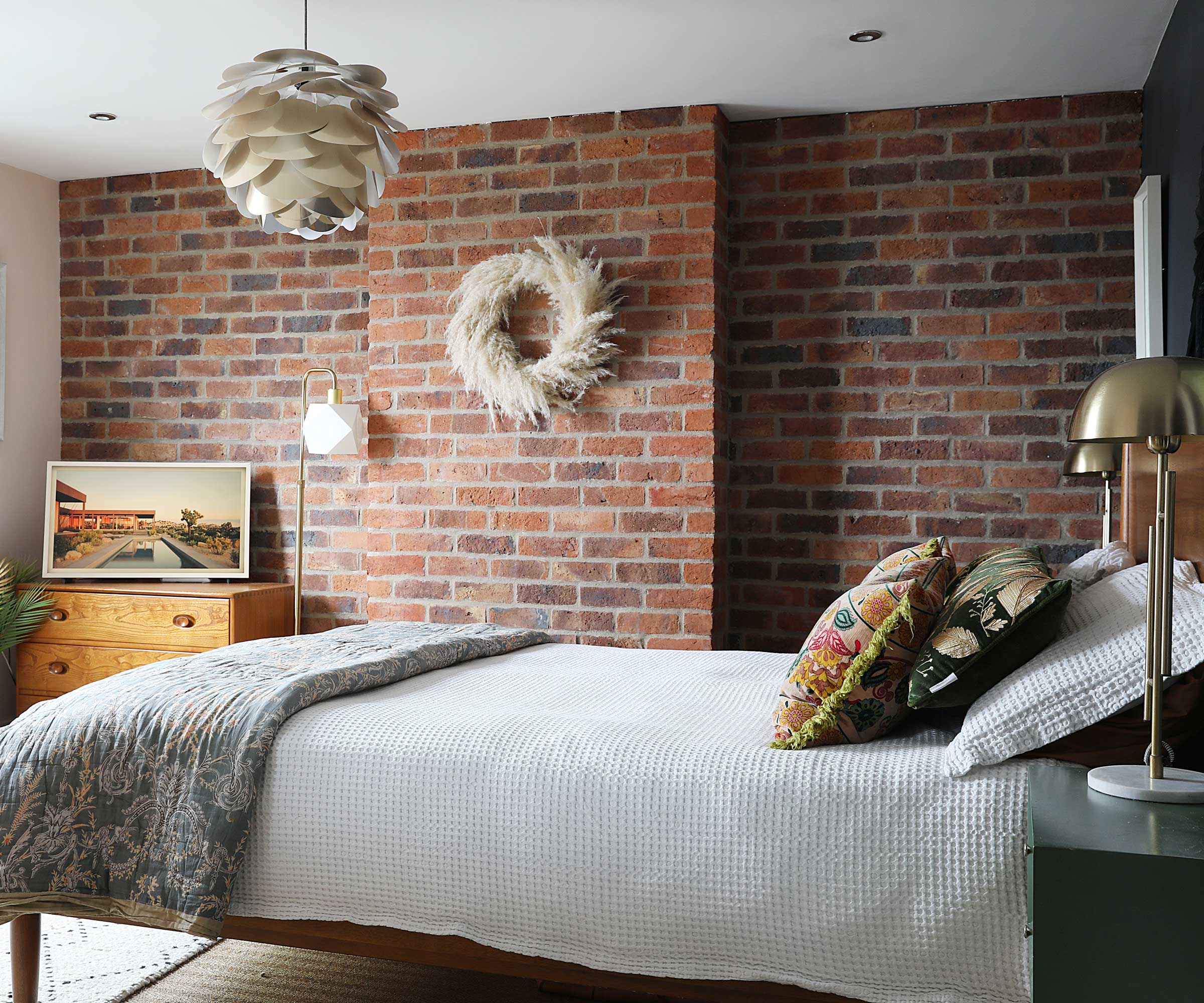 loft conversion bedroom with brick feature wall