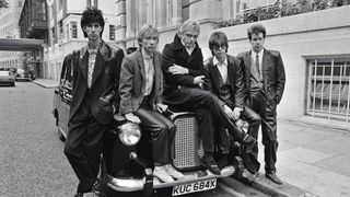 The Cars in 1984, posing on a London taxi