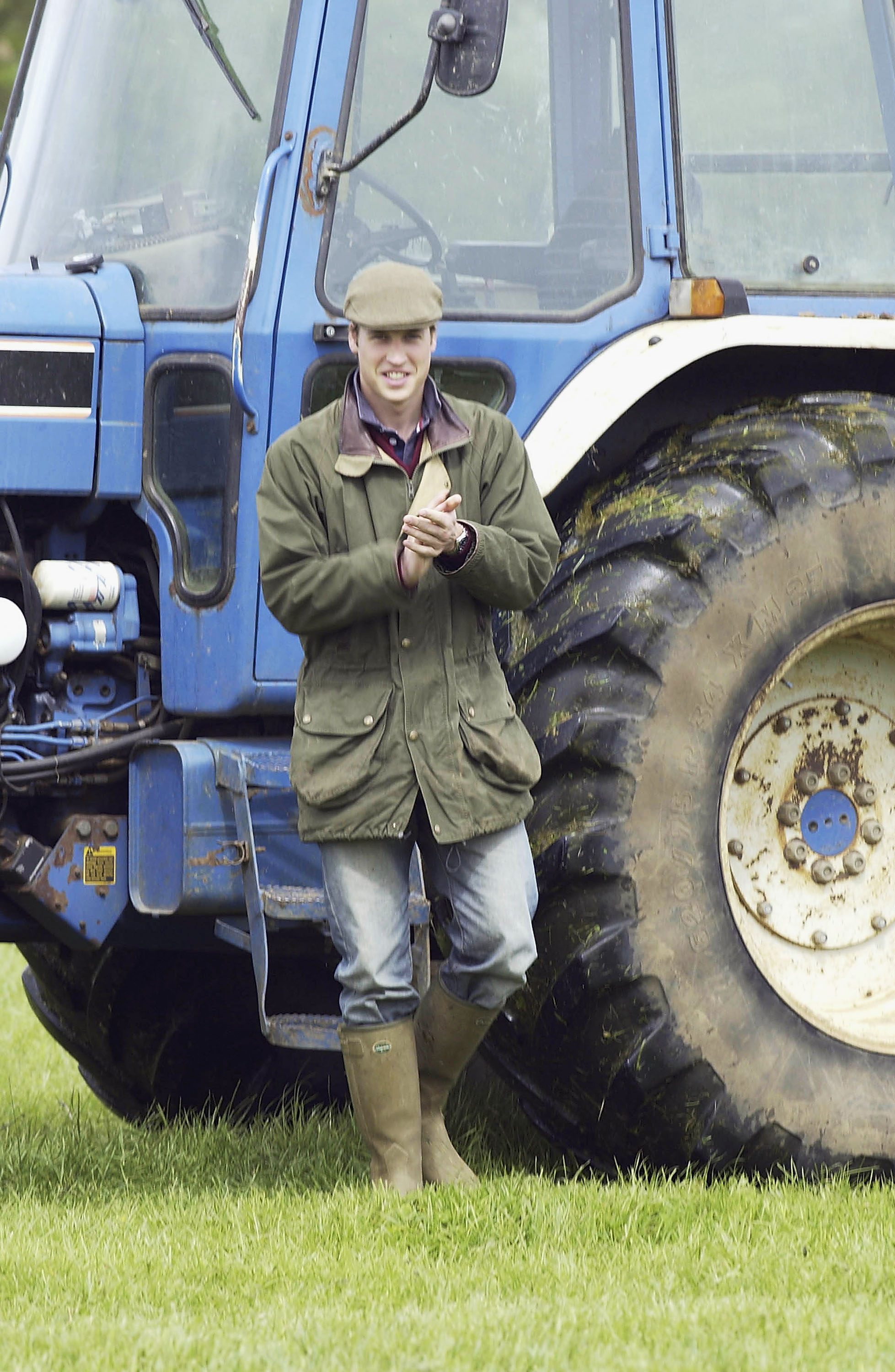 Prince William in front of a tractor