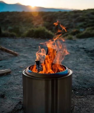 A Solo Stove smokeless fire pit at sunset